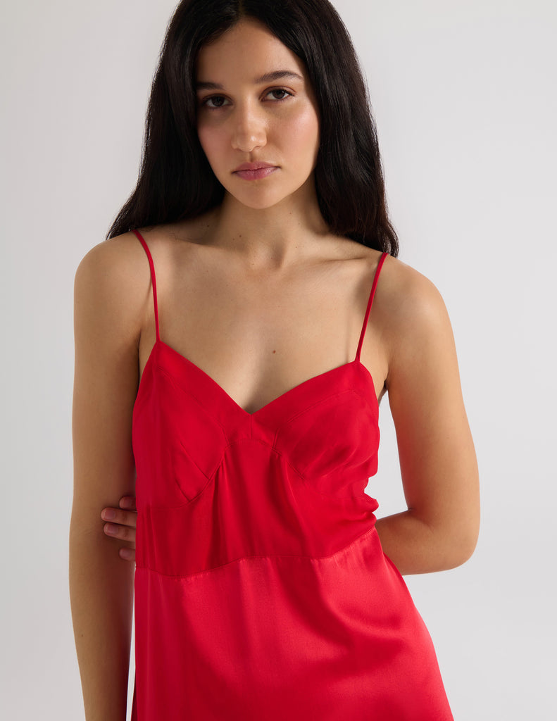 A model in the araks silk ingrid slip in scarlet red