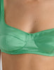 A model in the araks silk charmeuse penelope bralette and gwyneth panty in cypress green
