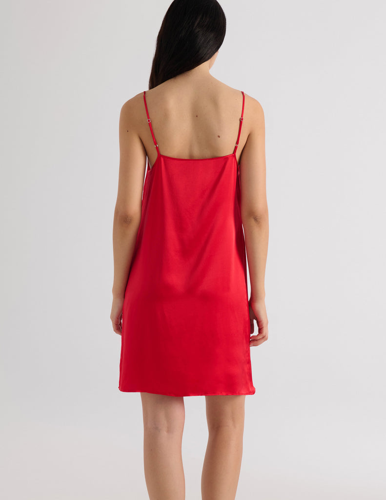 A model in the araks silk charmeuse toulouse slip in scarlet red
