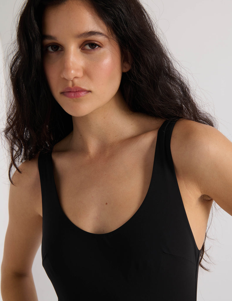 Model wearing Araks Harley one piece bathing suit in black