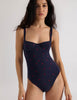 A model wearing the Araks Umi once piece in the shade Lagoon.