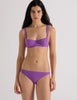Model wearing the Araks Ulija bikini top and Piper bikini bottom in violet