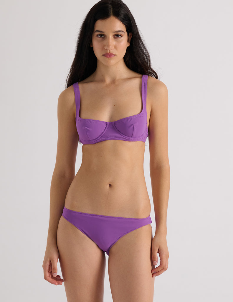 Model wearing the Araks Ulija bikini top and Piper bikini bottom in violet