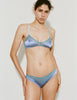 Model wearing Araks beatrice bralette in powder