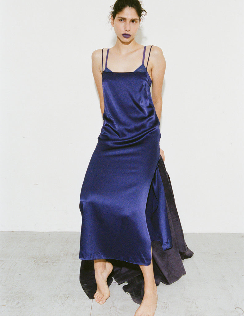 Model wearing Araka vika slip dress in starling