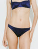 A model wearing a two-piece Gita Underwire  deep navy blue satin fabric shot against a plain white background.