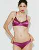A model wearing Willow bralette in Raspberry paired with Gwyneth panty against a plain light gray background.