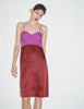 Model wearing Araks Ingrid slip in garnet