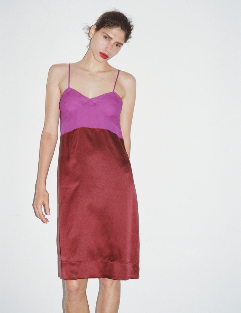 Model wearing Araks Ingrid slip in garnet