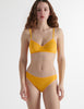 Front view of the woman wearing antonia orange marigold cotton bra and isabella panty