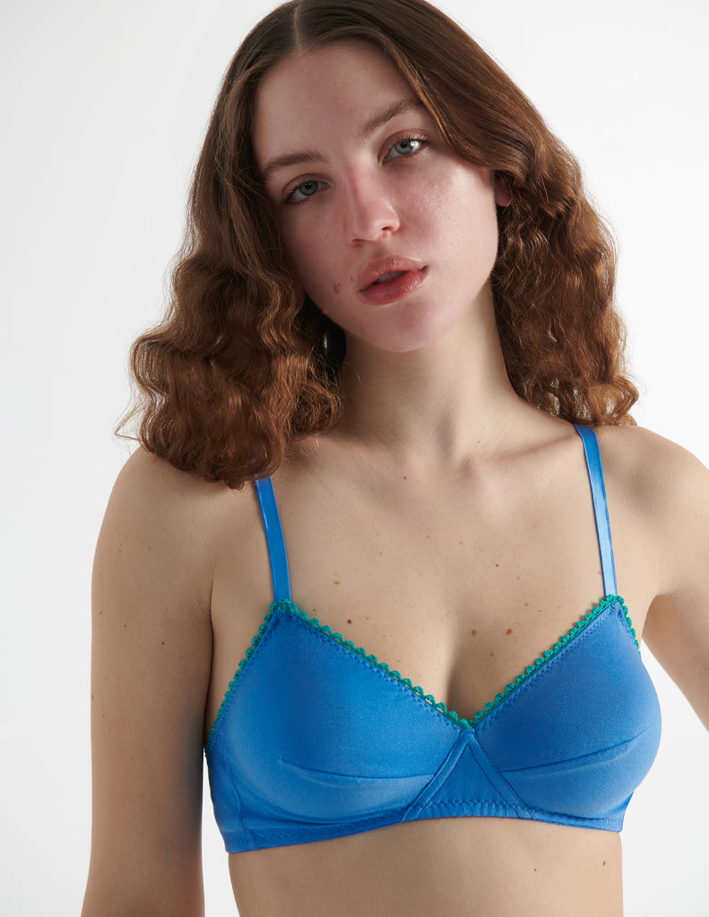 Close up view of the model wearing iris blue antonia cotton bralette