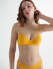 Front view of the woman wearing antonia orange marigold cotton bra with stella thong