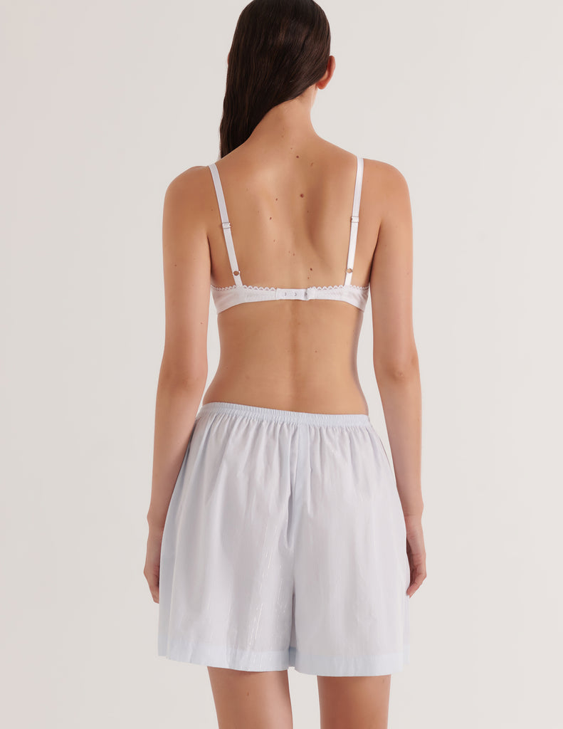 A model in the 100% cotton araks rose boxer in silver lurex stripe