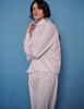 A model in the araks cotton suki pajama top and teagen pajama pant in stripe 