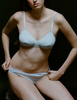 A model in the araks organic cotton antonia bralette and isabella panty in fondant blue