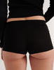 A model in the araks organic cotton presley short in black