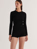 A model in the araks organic cotton sabine long sleeve and presley short in black