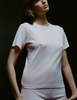 A model in the araks organic cotton tavi short sleeve in confection pink
