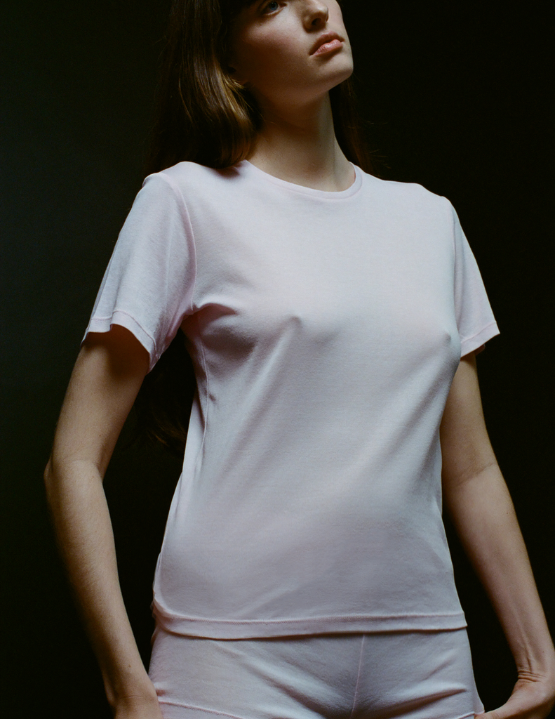 A model in the araks organic cotton tavi short sleeve in confection pink