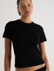 A model in the araks organic cotton tavi short sleeve in black