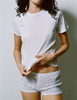 A model in the araks organic cotton tavi short sleeve in white