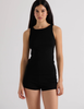 A model in the araks organic cotton uki tank and presley short in black