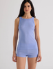 A model in the araks organic cotton uki tank and presley short in rococo blue