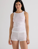 A model in the Araks organic cotton uki tank and presley short in white
