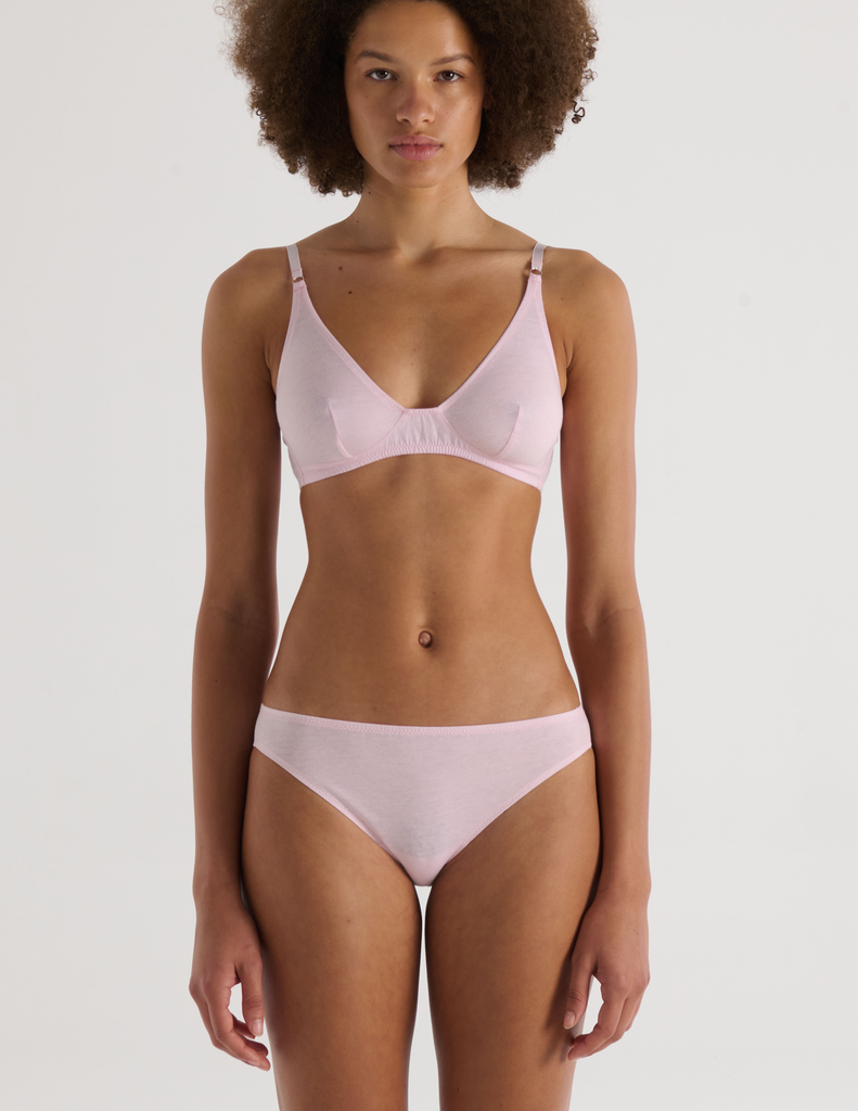 A model in the araks recycled cotton briar bralette in confection pink