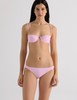 A model in the araks ovsanna bikini top and piper bikini bottom in ballet pink