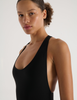 A model in the araks recycled tate one piece in black