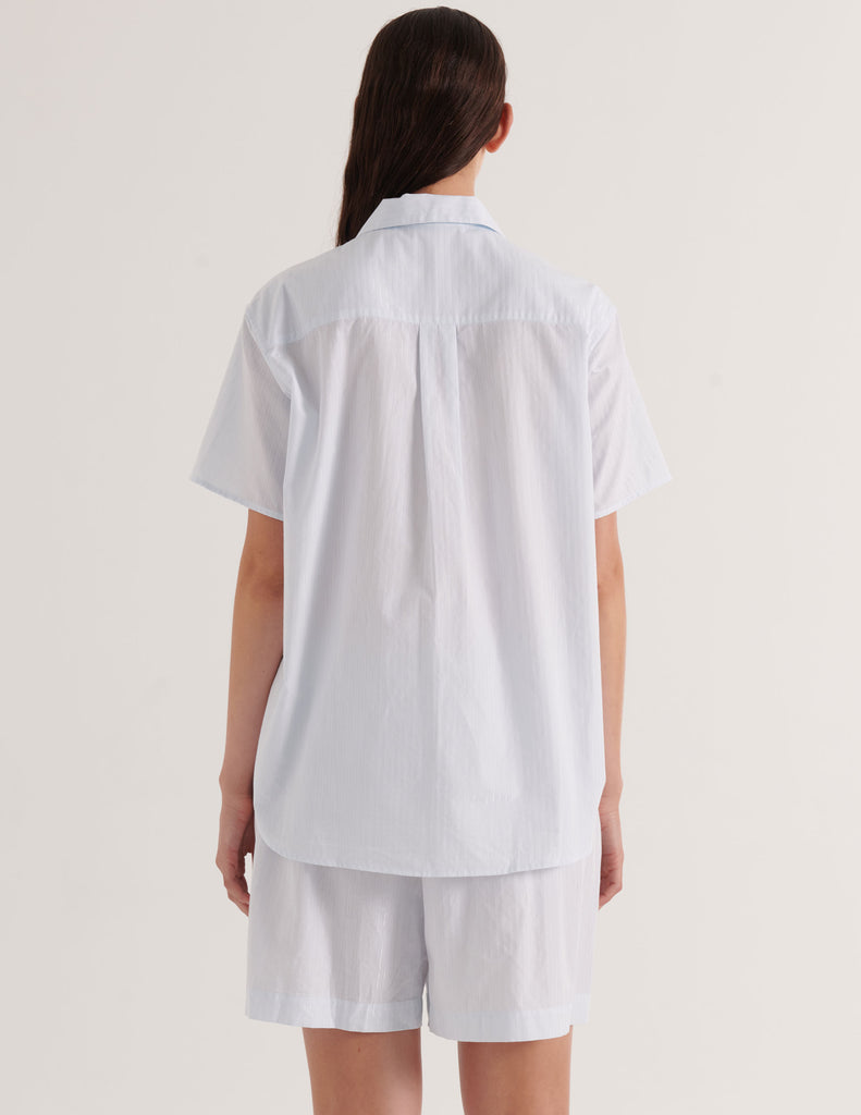 A model in the 100% coton araks samira pajama top in silver stripe and rose boxer