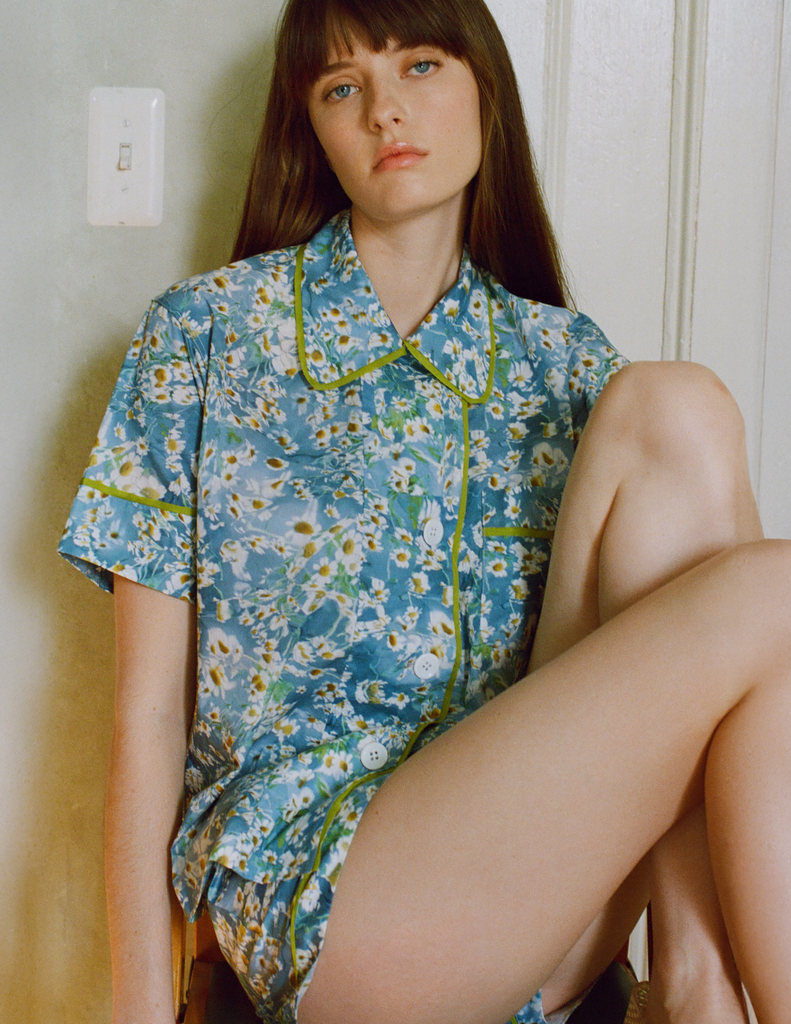 A model in the Araks shelby pajama top in daisy