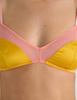 A model in the araks silk beatrice bralette in pomelo yellow