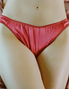 A model in the araks silk gwyneth panty in rose pink