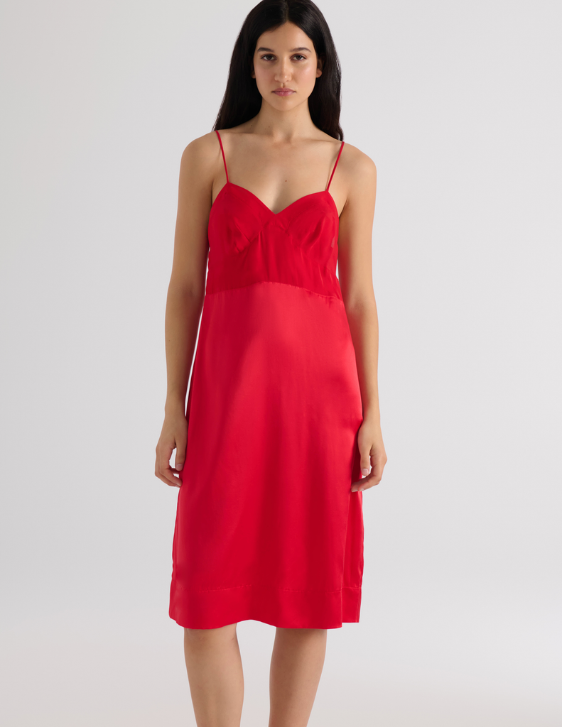 A model in the araks ingrid slip in scarlet