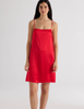 A model in the araks silk toulouse slip in scarlet red