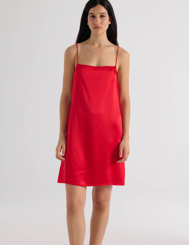 A model in the araks silk toulouse slip in scarlet red