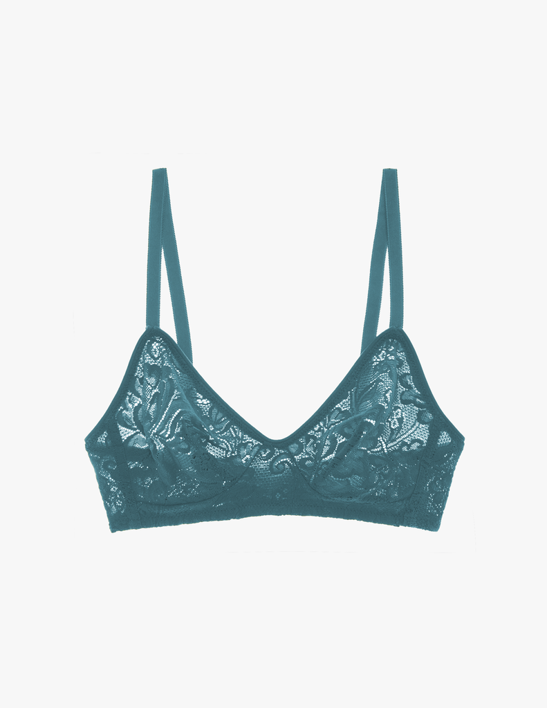 a flat lay image of the araks stretch lace tamara bralette in heron blue