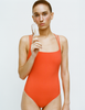 A model in the araks tallulah one piece in papaya orange