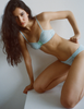 A model in the araks uma bralette and harriet panty in verona blue