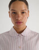 A model in the Araks suki pajama top in tart stripe