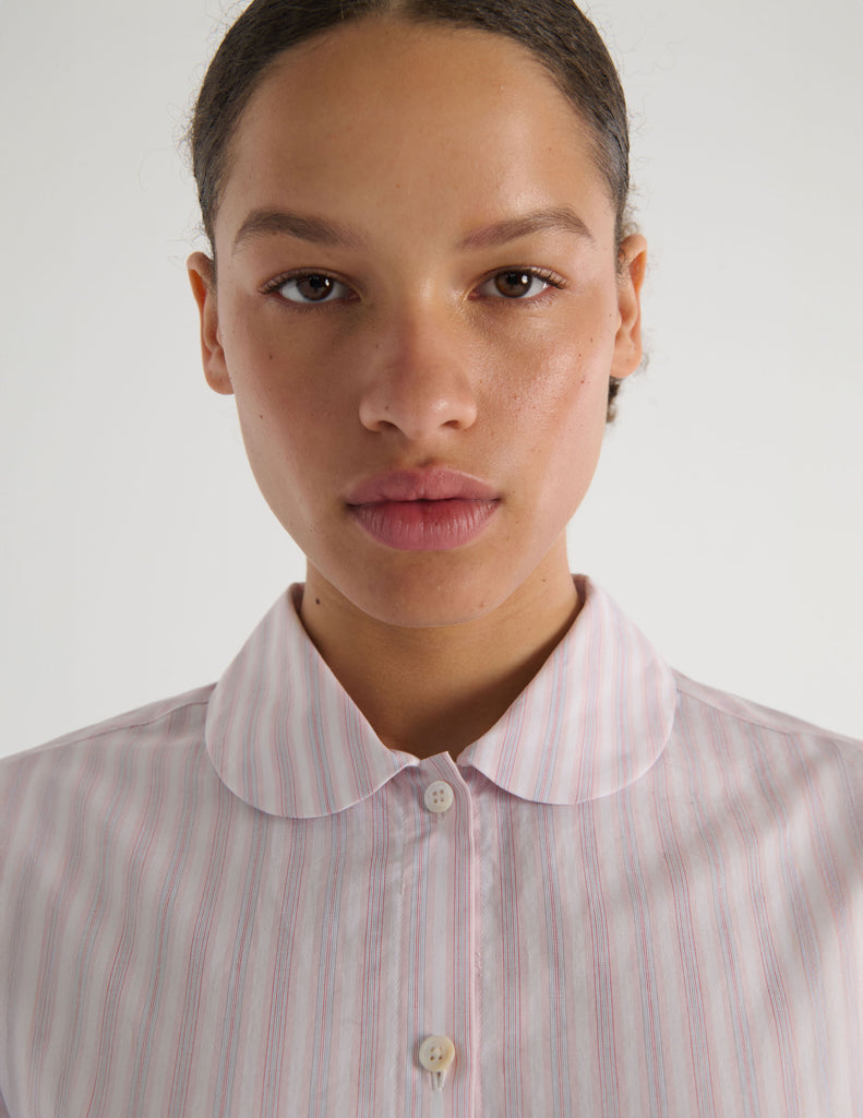 A model in the Araks suki pajama top in tart stripe