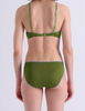 A model shown from the back wearing Araks Antonia bralette and Isabella panty in Moss set against a plain light gray background.