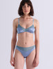 A woman modeling a two-piece lingerie set in a Powder set against a plain light gray background.