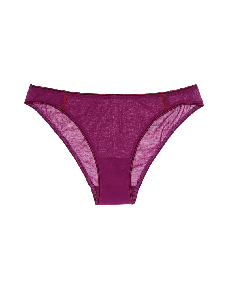 A model in the araks cotton crepe harriet panty in cranberry red