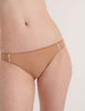 A model in the araks cotton and silk harriet panty in brulee brown