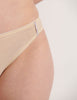 An up close image of a model in the silk and cotton harriet panty in lavender and cream