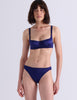 A woman modeling Araks Gita underwire bra with the Gwyneth panty in Starling