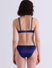A woman modeling Araks Gita underwire bra with the Gwyneth panty in Starling